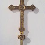 Close up of the detailed head of the Processional Cross  and inscription.