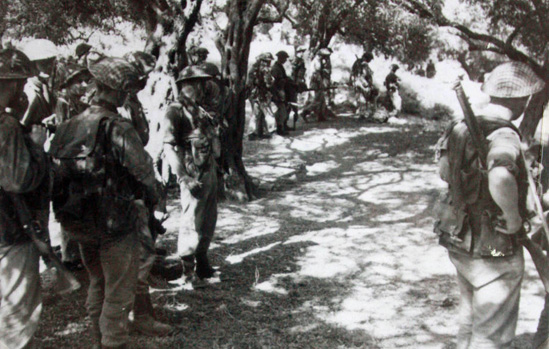No.2 Commando 5 troop line up to attack from an orchard at Spilje, Albania