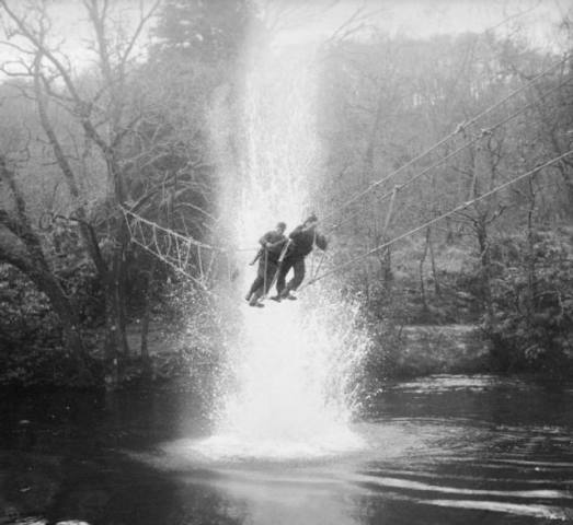 Commando trainees crossing a toggle bridge at Achnacarry